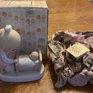 Precious moments figurine ‘the hand that rocks the future.’